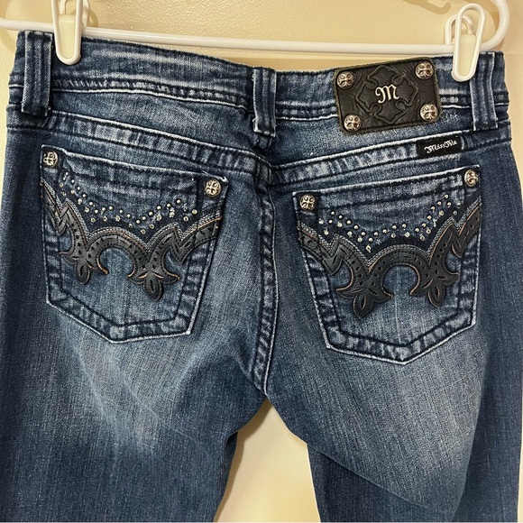 Miss Me Denim - Miss Me Dark Blue Boot Cut Jeans with rhinestone embellishment.